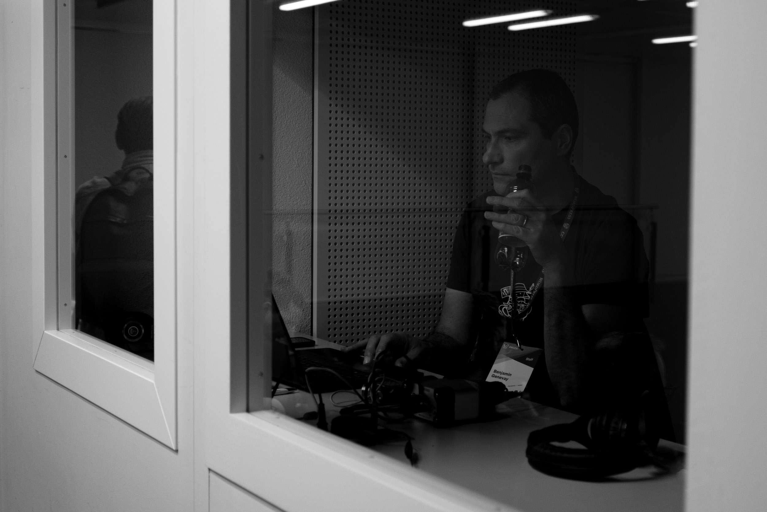 Benjamin Genevay sitting in the audio-booth of the Aula room, making sure we get the perfect sound.