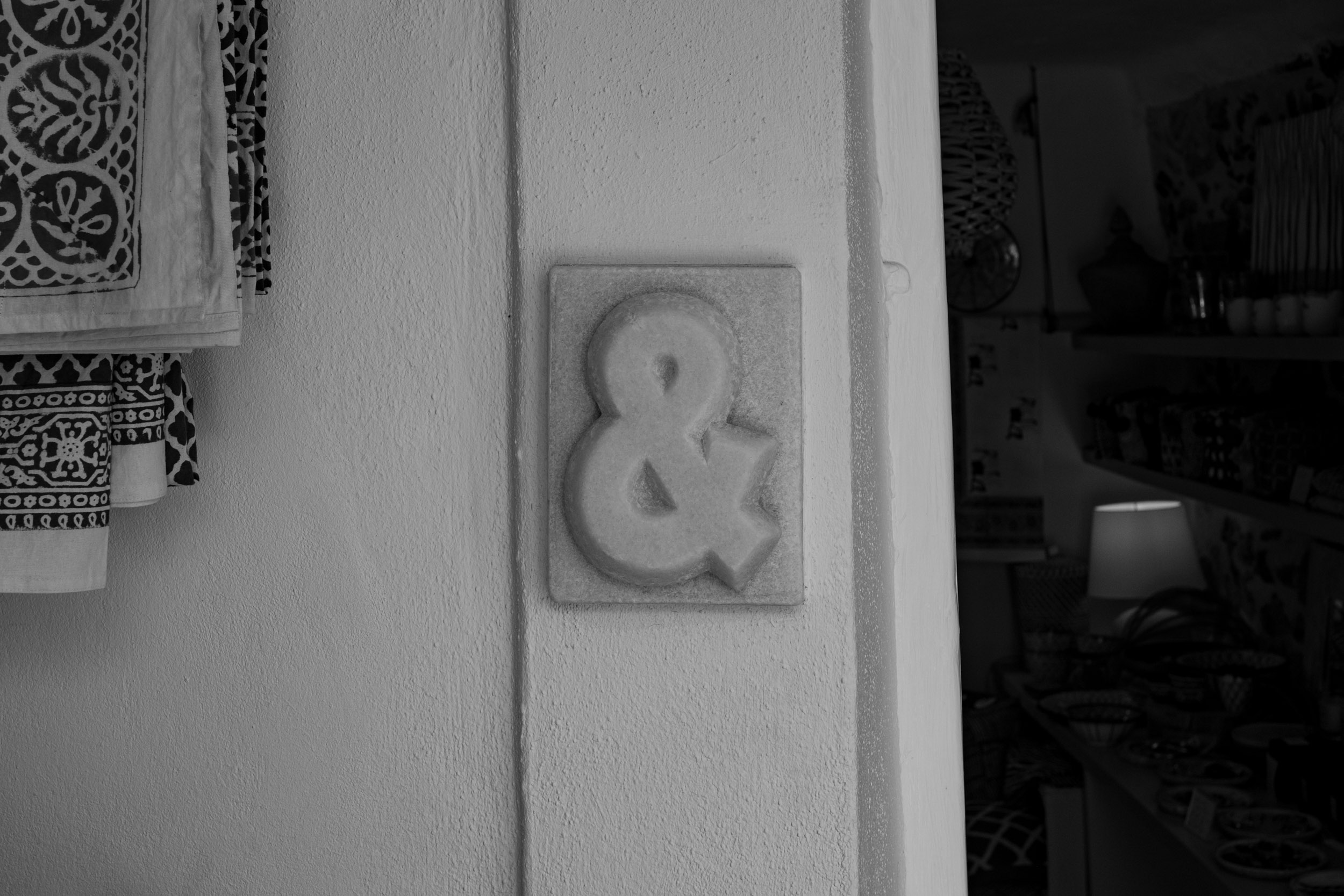 A beautiful marble ampersand sign at the front door of a shop in Naxos.