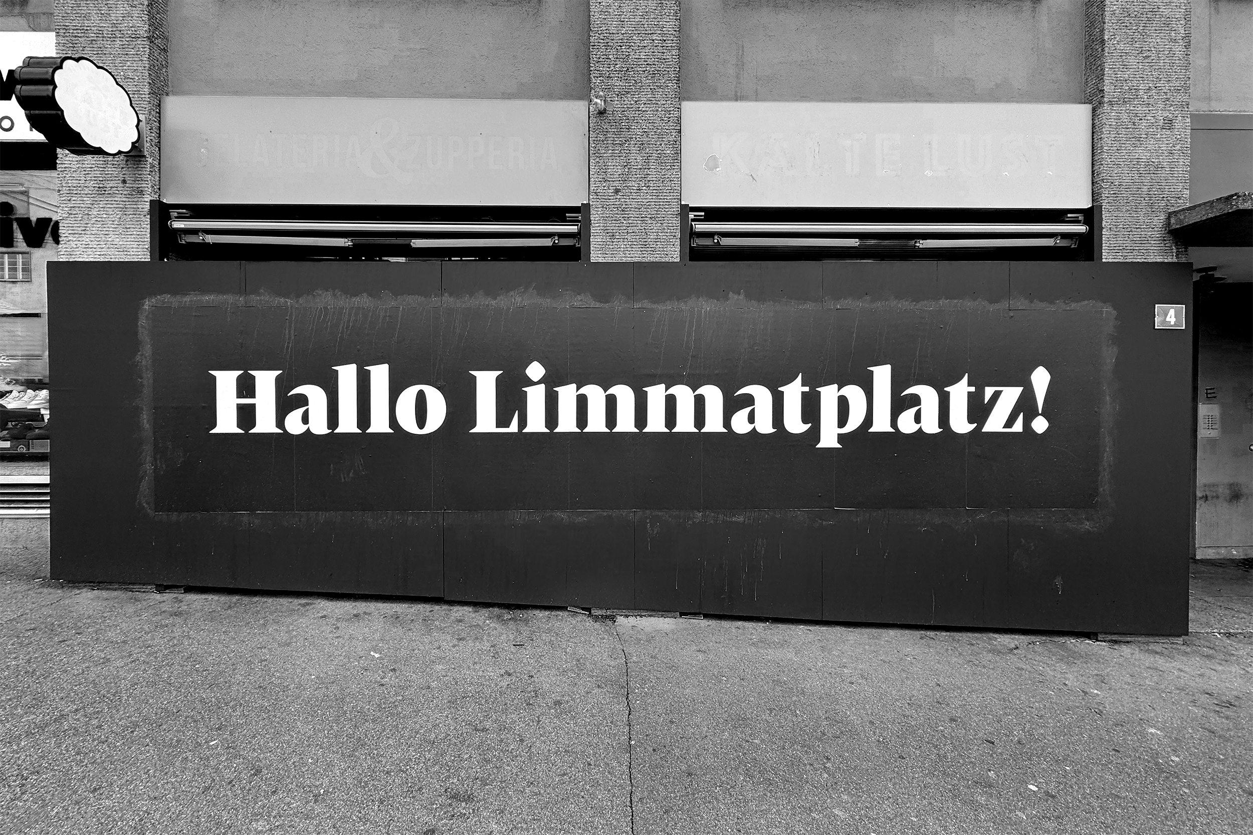 A temporary sign reading "Hallo Limmatplatz!" at, well, Limmatplatz in Zurich.