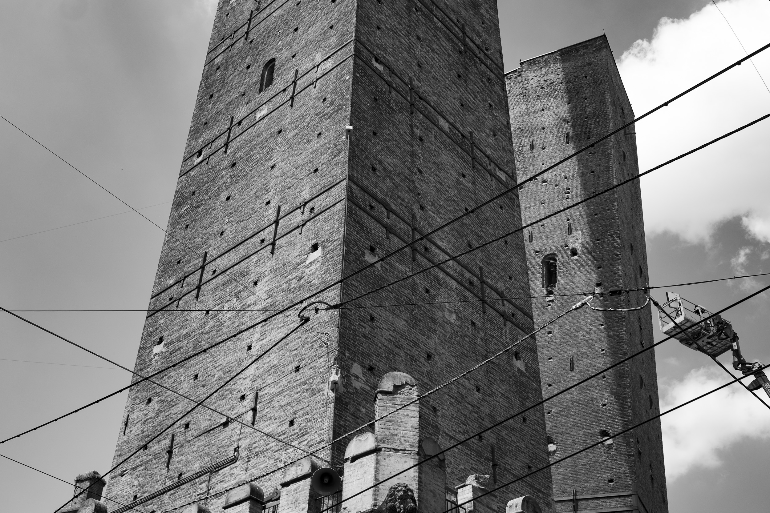 The "Two Towers" (Due Torri, in Italian) of Bologna, viewed from below, where it is hardly visible how much one of them leans dangerously to the side.
