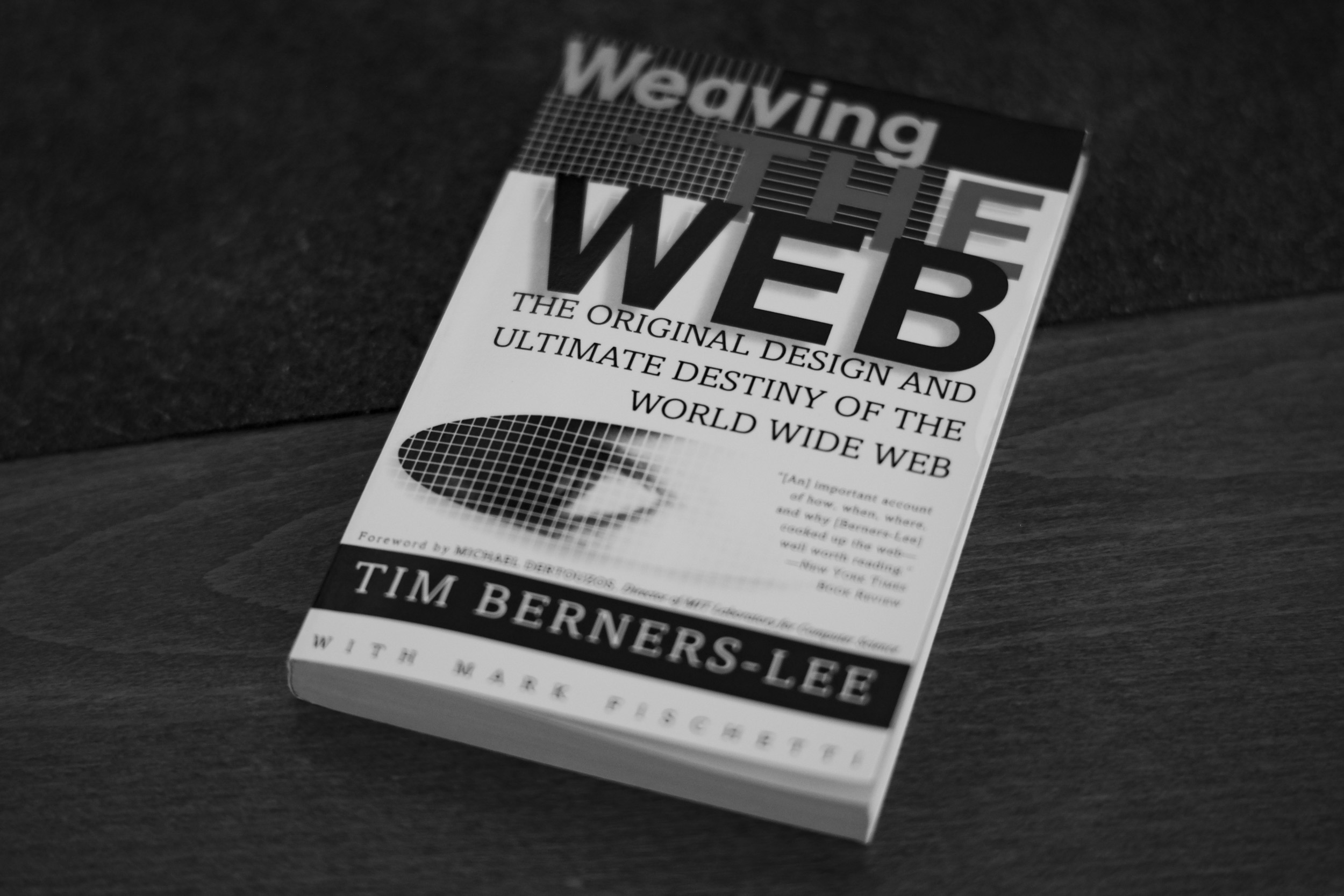 Black & White photograph of the book "Weaving the Web" by Tim Berners-Lee, lying on my desk.