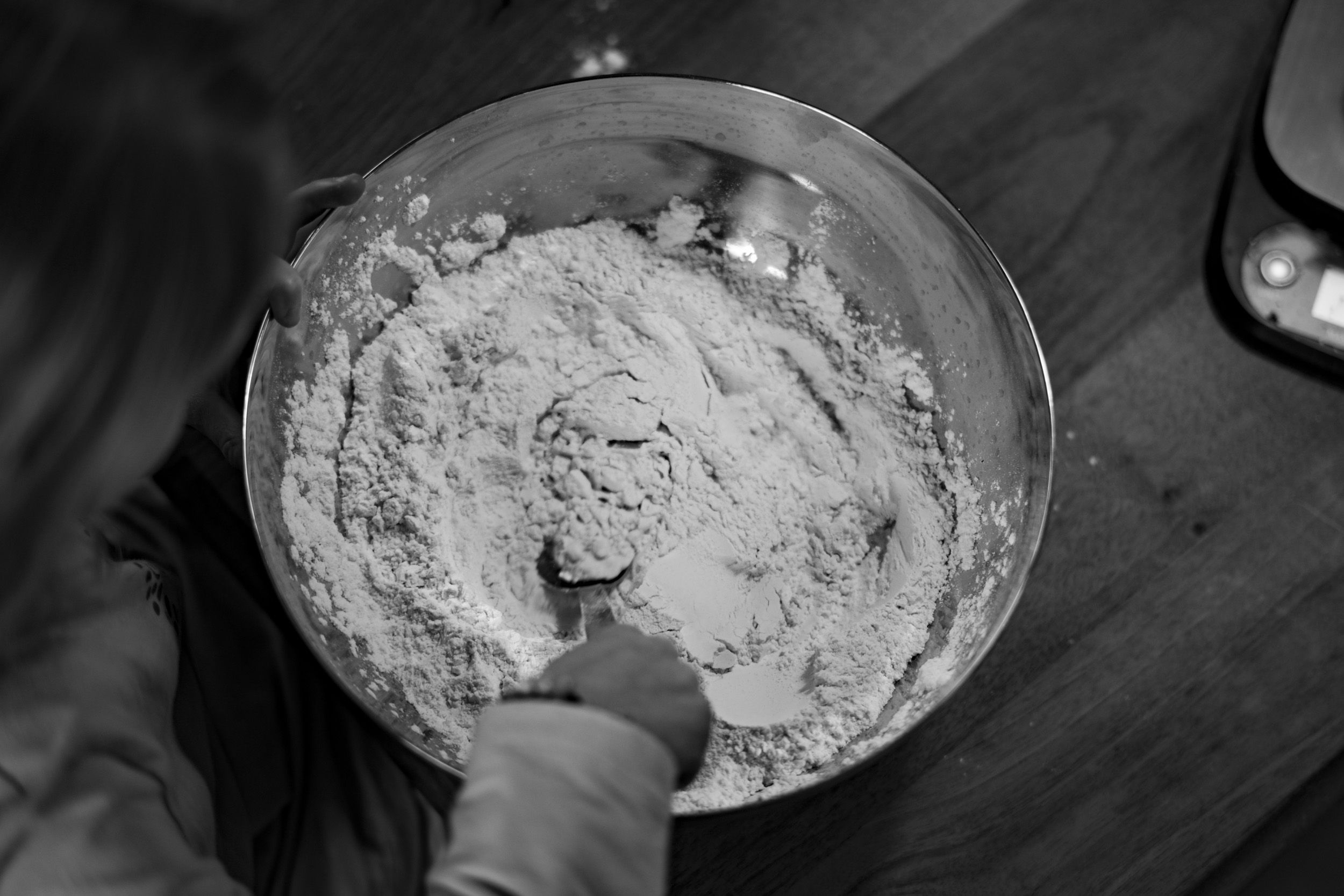 Mixing flour into pizza dough for some "Schlangenbrot" (Campfire Bread).